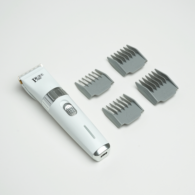 PurePaw dog clipper with its comb attachments