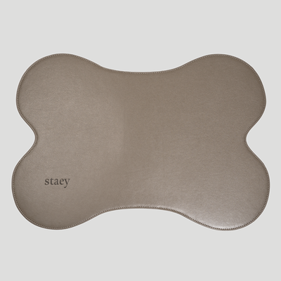 Alva bone-shaped feeding mat in soft grey, seen from above