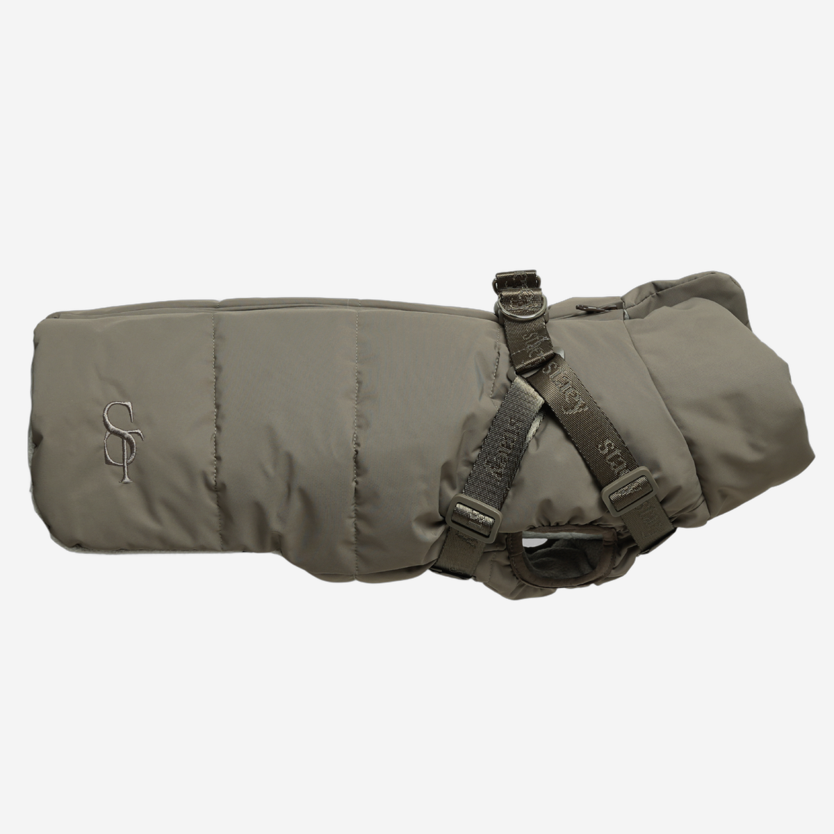 Vera quilted dog coat in sage with a built-in harness, side view