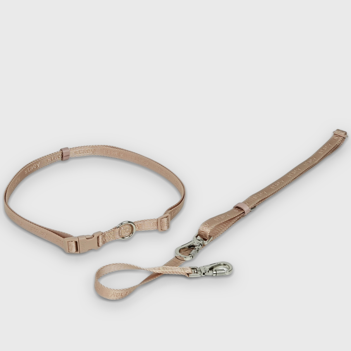 The light rose hands-free leash laid out with its waist strap and hooks